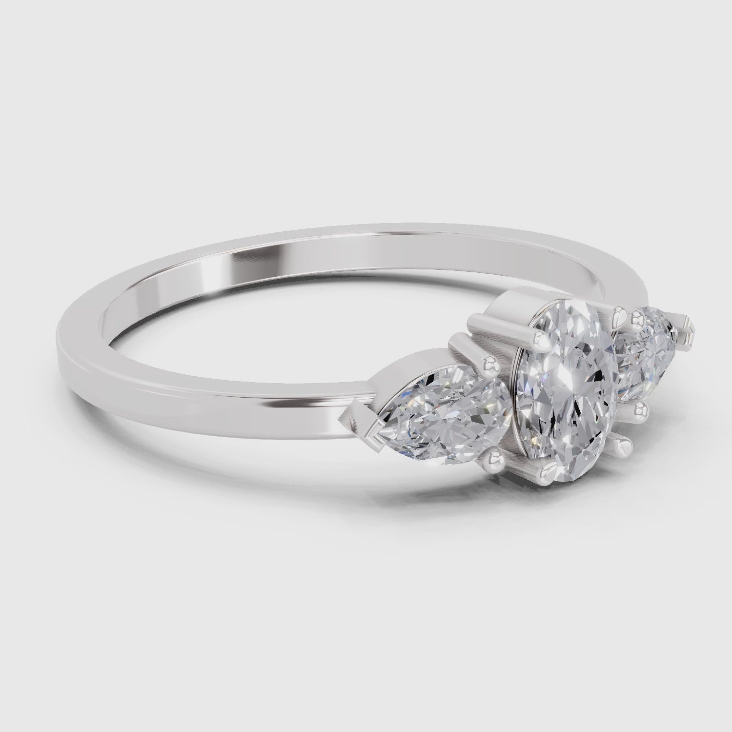0.60 Carat Three-Stone Oval & Pear Diamond Engagement Ring | 14K White Gold